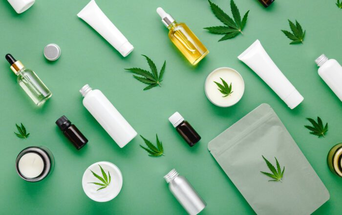 Hemp cbd oil serum in glass dropper bottle with cannabis leaves, Moisturizing cream, Serum, lotion, essential oil Cannabis leaf with skincare cosmetic product Flat lay pattern on green background